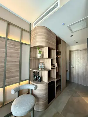 a room with a chair and a book shelf at Cityloft 147 in Istanbul