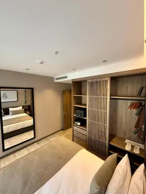 a bedroom with a bed and a large mirror at Cityloft 147 in Istanbul