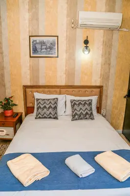 a bedroom with a bed with two towels on it at ASİTANE life HOTEL in Istanbul