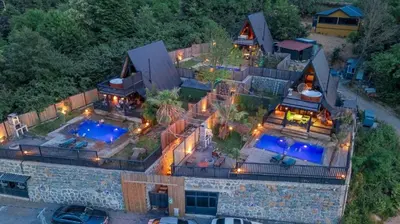 an aerial view of a house with a swimming pool at Hill House Bungalov in Sapanca