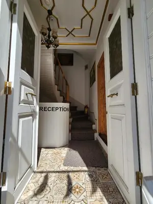 a hallway with a staircase with a ceiling at Kadıköy White House in Istanbul