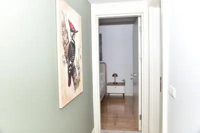 a hallway with a bird picture on the wall at Safir Suite in Istanbul