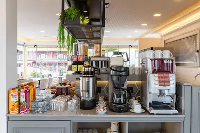 a coffee shop with a coffee maker on a counter at Best Point Hotel Sultanahmet,Istanbul in Istanbul