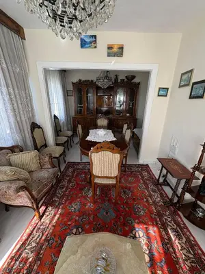 a living room with a table and chairs at Efe Apart Hotel in Istanbul
