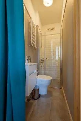 a bathroom with a toilet and a sink and a tub at Applehill in Istanbul