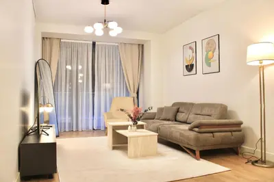 a living room with a couch and a table at Taksim Petek Residence in Istanbul