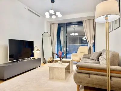 a living room with a couch and a tv at Taksim Petek Residence in Istanbul