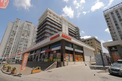 a building in the middle of a city at Luxury Designed Comfortable 2 Rooms & 1 Living room Apartment Free Parking Garaj in Esenyurt