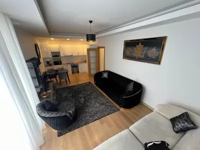 a living room with a couch and two chairs at Luxury Designed Comfortable 2 Rooms & 1 Living room Apartment Free Parking Garaj in Esenyurt