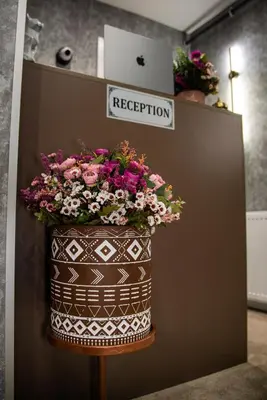 a large pot of flowers on a wall at Huzur Apart Hotel in Istanbul