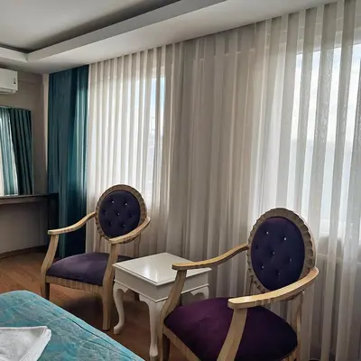 two chairs and a table in a hotel room at Elite Dumanlar in Istanbul