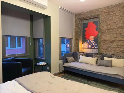 a living room with a couch and a bed at Stunning Private House in Balat in Istanbul