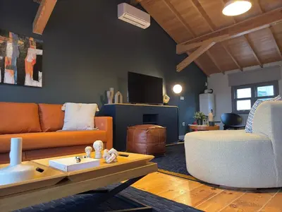 a living room with a couch and a chair at Stunning Private House in Balat in Istanbul