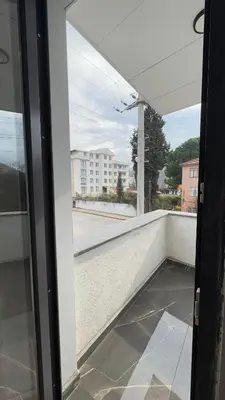 a view from a glass door of a balcony at Lions Boutique Hotel in Altınova