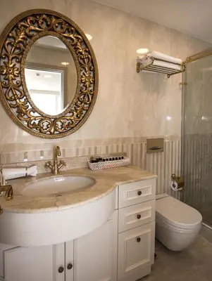 a bathroom with a sink and a mirror at Le Marde Hotel in Istanbul