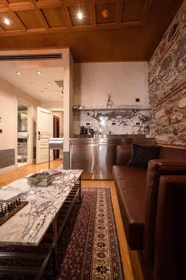 a living room with a couch and a table at Stone Inn Galata in Istanbul