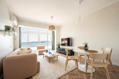 a living room with a couch and a table at Stay Beyond the Bosphorus #6 in Istanbul