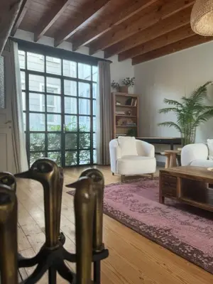 a living room with a couch and a table at Old Town Loft in Balat in Istanbul