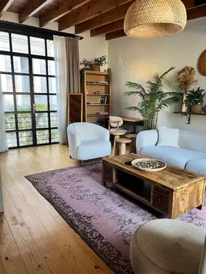 a living room with a couch and a coffee table at Old Town Loft in Balat in Istanbul