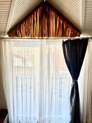 a window with a black and white curtain at Blueway Hotel Residence in Istanbul