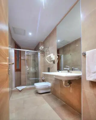 a bathroom with a toilet and a sink and a shower at Blueway in Istanbul