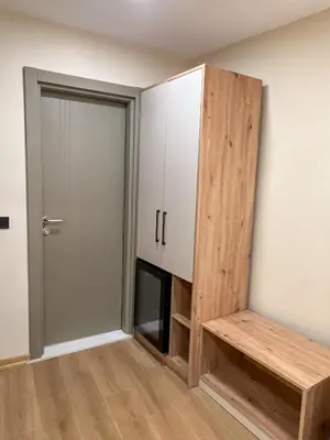 a room with a cabinet and a bench next to a door at Tophane Mansion Karakoy in Istanbul
