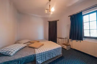 a bedroom with a bed and a window at Sapancada ısıtmalı havuzlu villa in Sapanca
