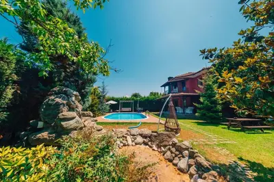 a yard with a swimming pool and a house at Sapancada ısıtmalı havuzlu villa in Sapanca