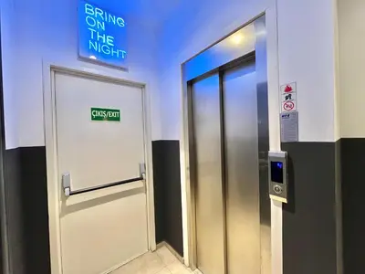 an elevator in a building with a sign on the wall at Fitas Oda Hotel in Istanbul