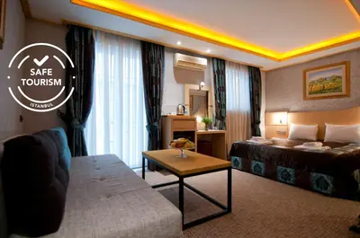 a hotel room with a bed and a couch at Grand Ambiance Hotel in Istanbul