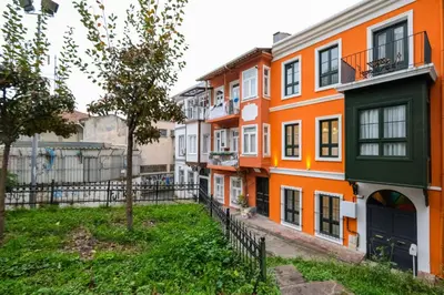 a row of orange and white buildings in a city at Casa Isabel - Amazing 5Br House in Prime Location in Istanbul