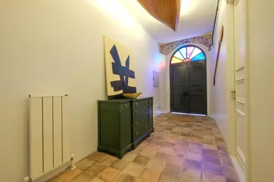 a hallway with a green dresser and a black door at Casa Isabel - Amazing 5Br House in Prime Location in Istanbul