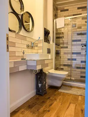 a bathroom with a sink and a toilet and a shower at Rent the Entire Bosphorus House in Istanbul