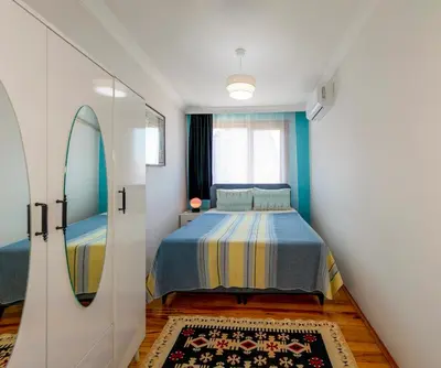 a bedroom with a bed and a mirror at Golden Horn Hidden Haven in Istanbul
