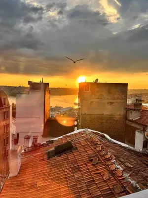 a view of the sunset from the roof of a building at Golden Horn Hidden Haven in Istanbul