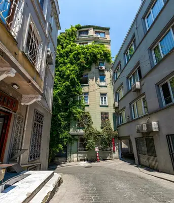 an empty street in front of a tall building at Golden Horn Hidden Haven in Istanbul