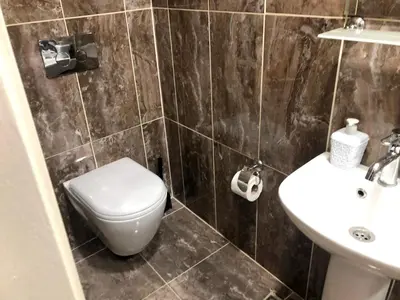 a bathroom with a toilet and a sink at Istanberry - Joker Apartments in Istanbul