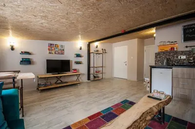 a large living room with a television and a table at Newway Apartments in Istanbul