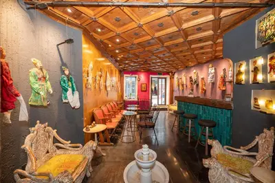 a room with a bar with chairs and tables at TaksimAntiqueOtel in Istanbul