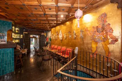 a restaurant with a large mural on the wall at TaksimAntiqueOtel in Istanbul