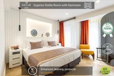 a hotel room with a bed and a chair at BAB - by Menar Hotel in Istanbul
