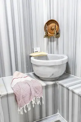 a bathroom with a sink and a mirror on the wall at BAB - by Menar Hotel in Istanbul