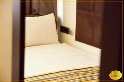 a small bed with a pillow in a room at PALMYE HOTEL Beyoylu in Istanbul