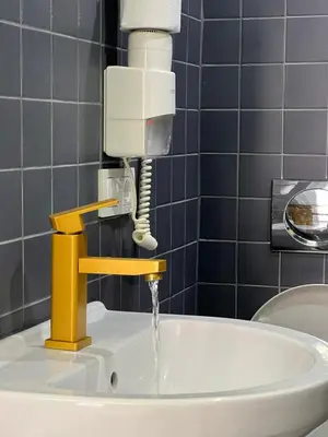 a sink with water coming out of a faucet at feridiye 71 in Istanbul