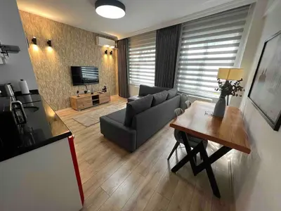a living room with a couch and a table at Akaretler City View between Nişantaşı and Beşiktaş in Istanbul