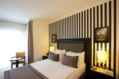 a hotel room with a bed with two pillows at Avantgarde Urban Taksim in Istanbul