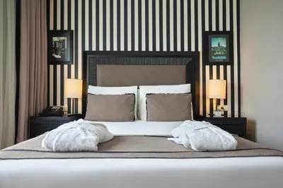 a bedroom with a large bed with two pillows at Avantgarde Urban Taksim in Istanbul