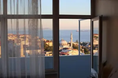 a view of a city from a window at Bosphorus view, Great location and Cozy House! in Istanbul