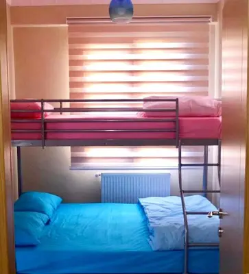 two bunk beds in a room with a window at Ada Villam in Sapanca