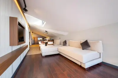 a living room with a white couch and a television at 216 Bosphorus Suite in Istanbul